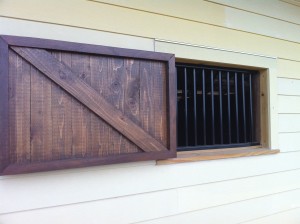 Custom Fabricated Metal Window Bars and Wooden Shutter